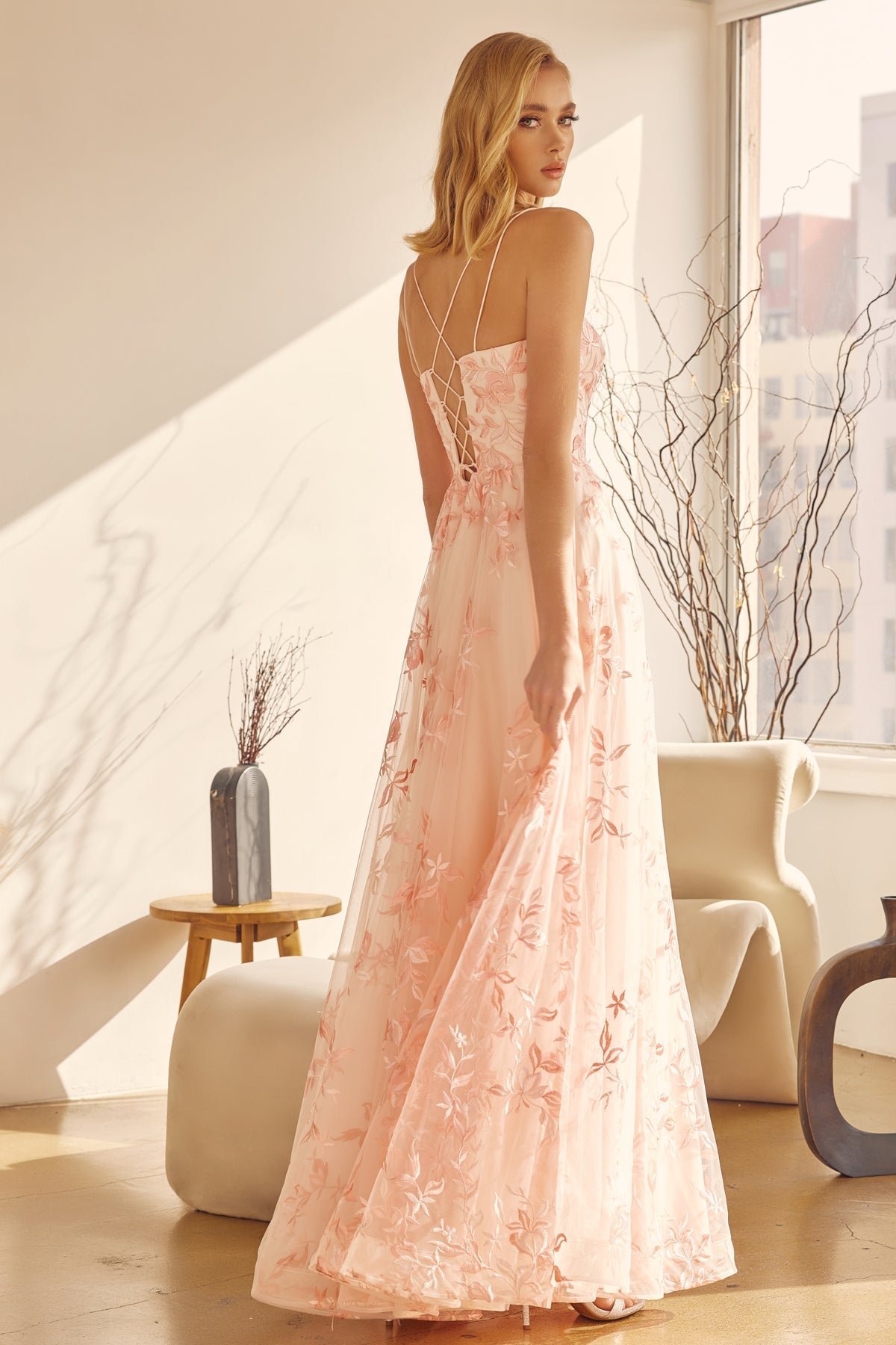 Captivating Elegance: Sleeveless Embroidered Lace Gown by [Brand Name]