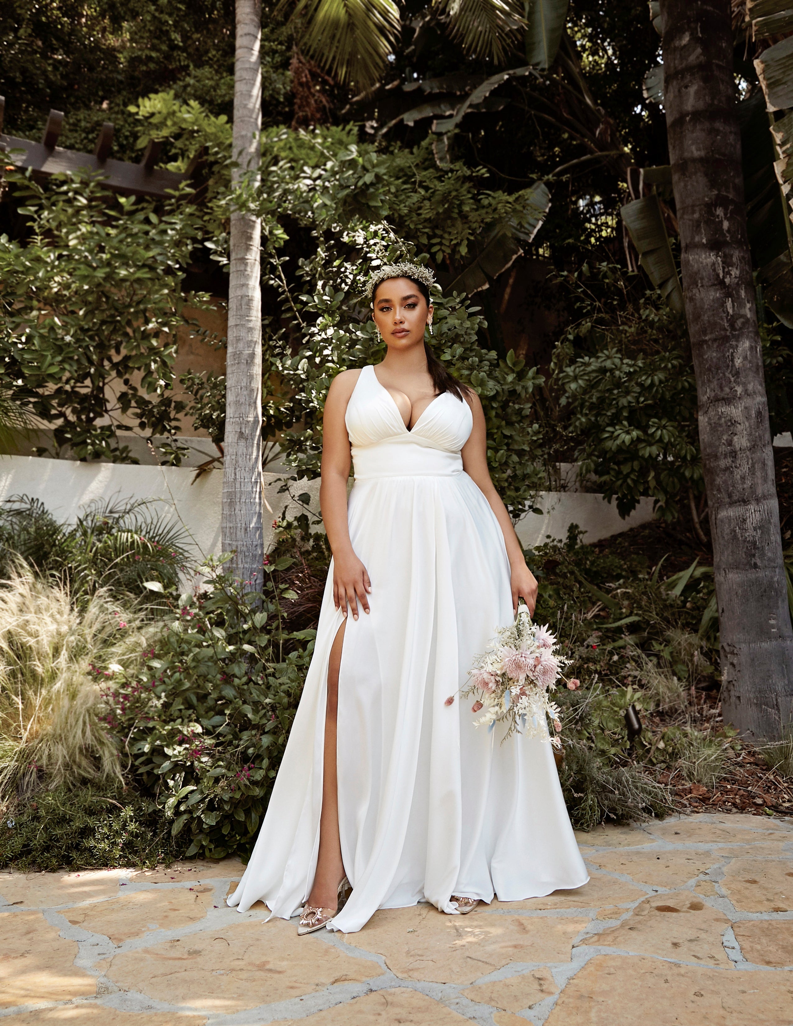 Enchanting Elegance: Cinderella Divine's Thigh-Grazing Wedding Gown